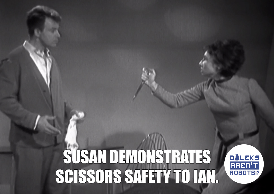 (Image of Susan threatening Ian with scissors) Susan demonstrates scissors safety to Ian.